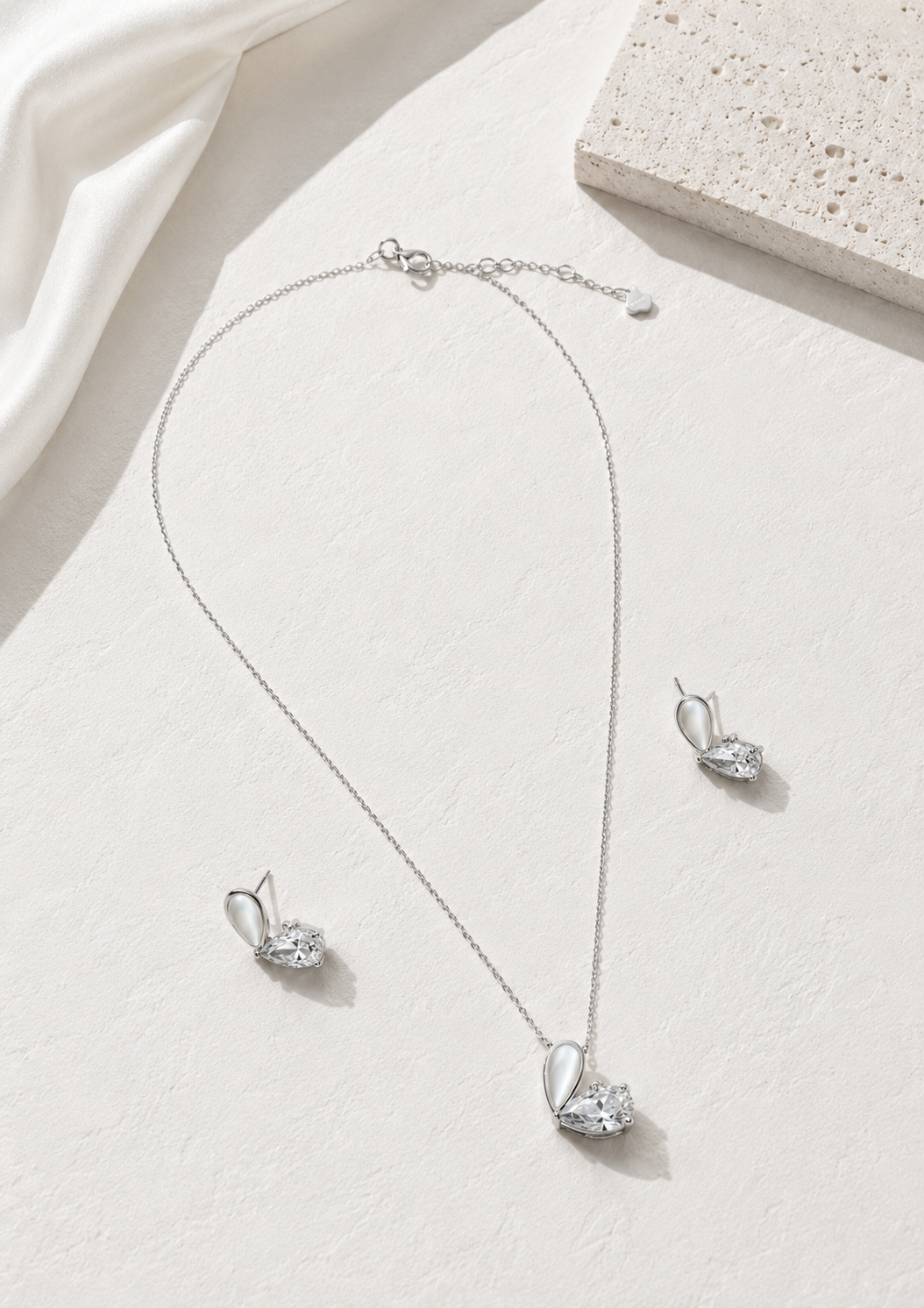 925 sterling silver necklace and earrings set featuring sparkling pear cut cubic zirconia stones