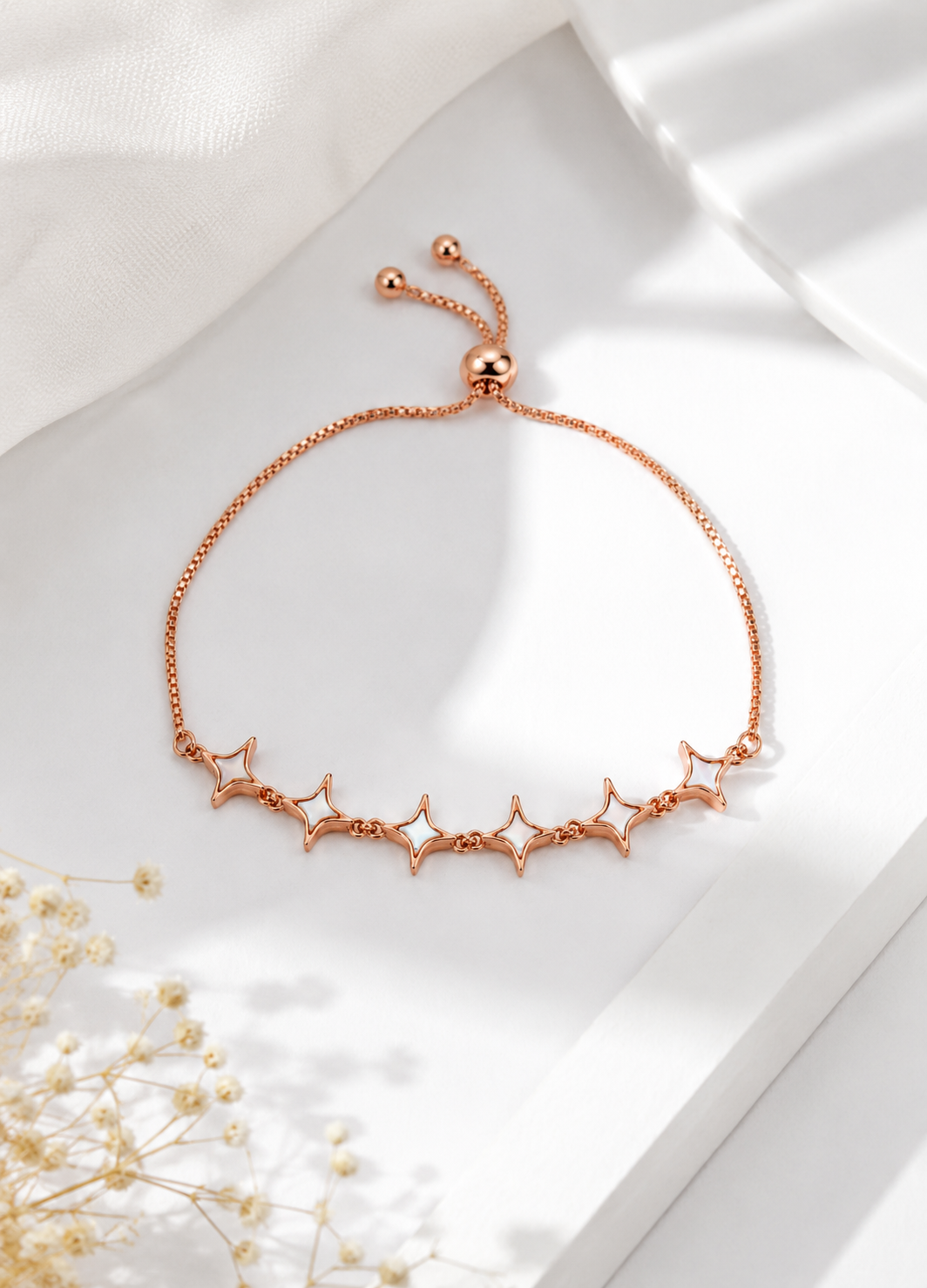 Elegant rose gold adjustable star bracelet with modern design