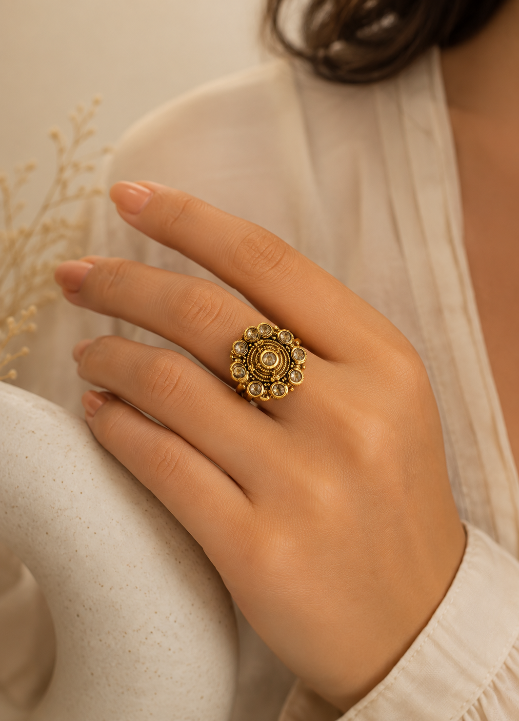 ORELVA Advika antique floral adjustable gold-plated ring worn by a woman featuring sparkling Kundan-style crystal stones.