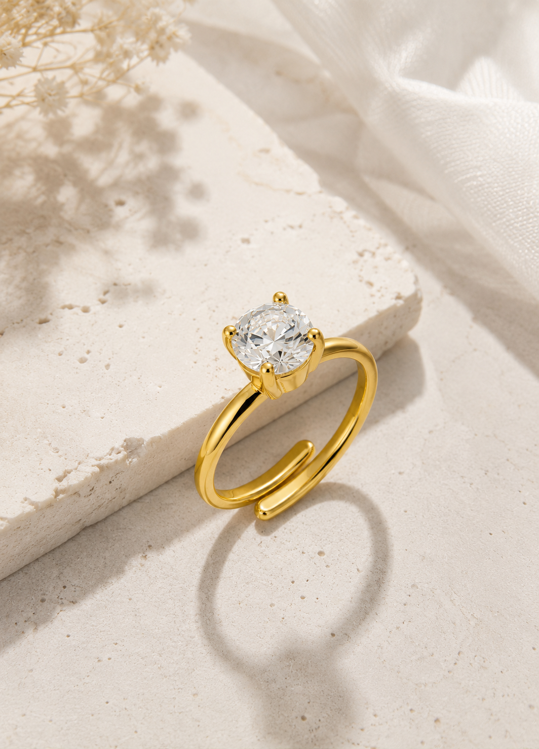 ORELVA Gold-Plated Adjustable Solitaire Ring featuring a sparkling round cubic zirconia in a modern minimalist design