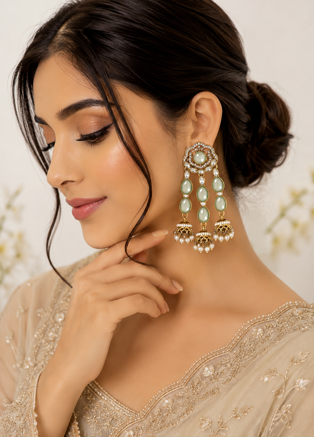 ORELVA Nooré mint green Polki jhumka earrings worn by a model with ethnic outfit.