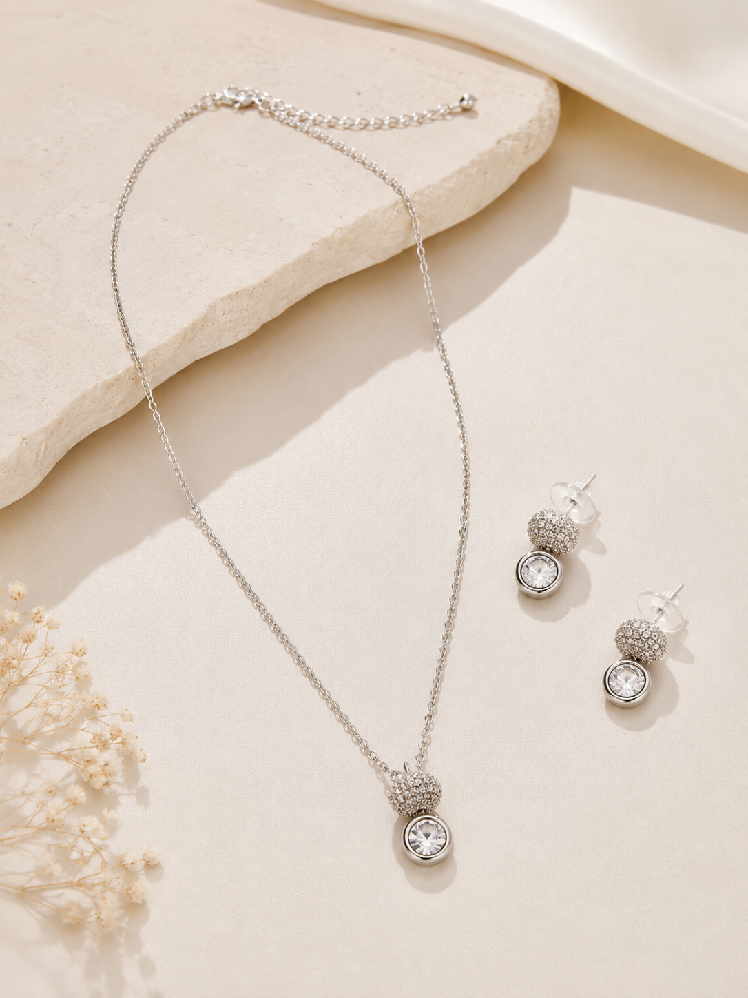 Elegant silver tone pendant necklace with matching crystal stud earrings for women