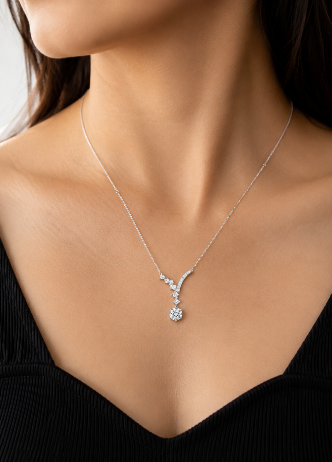 925 Sterling Silver sparkling drop necklace featuring a curved cubic zirconia design with a solitaire pendant.