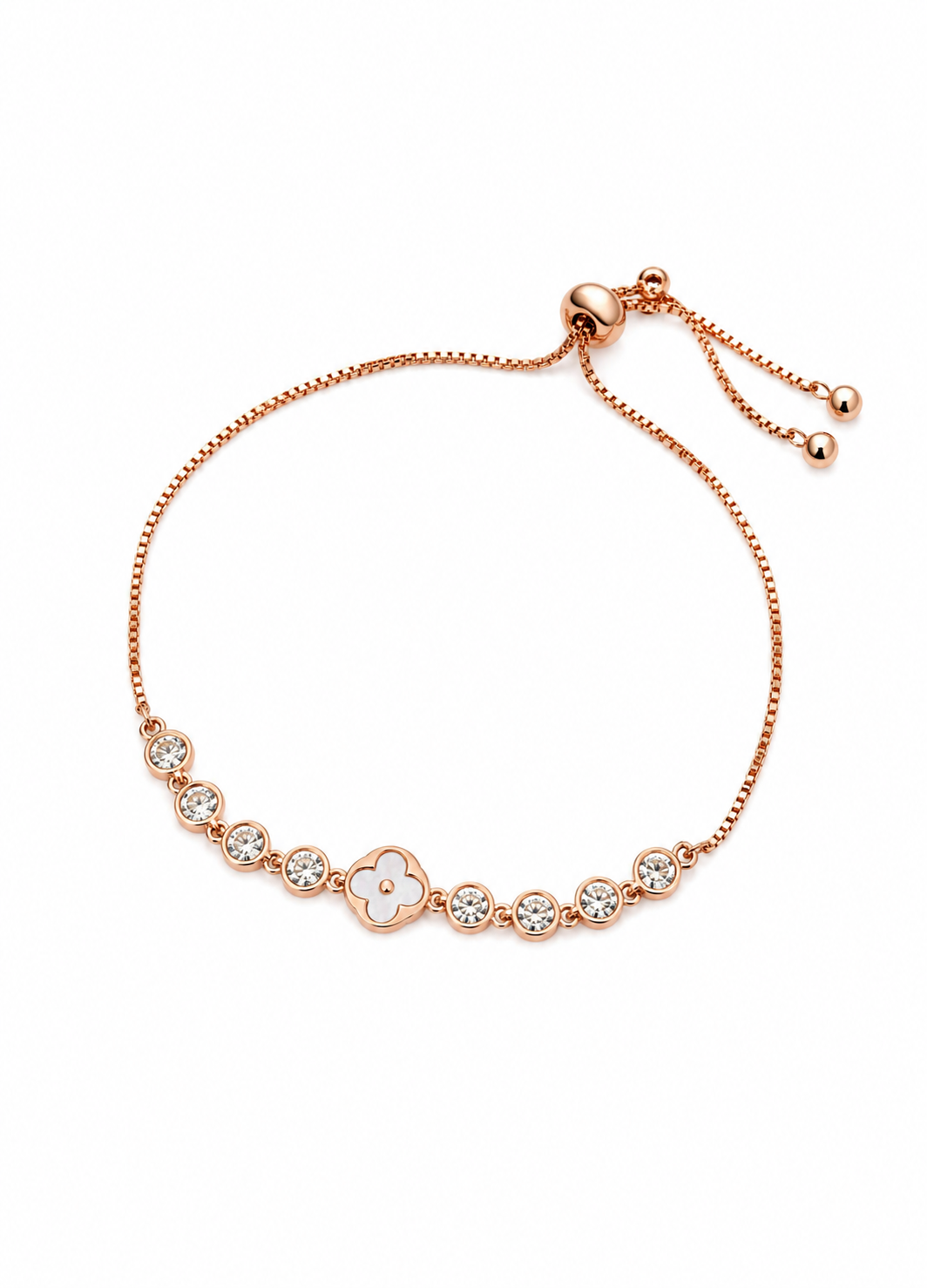 Close-up of Orelva adjustable crystal clover bracelet with rose gold finish