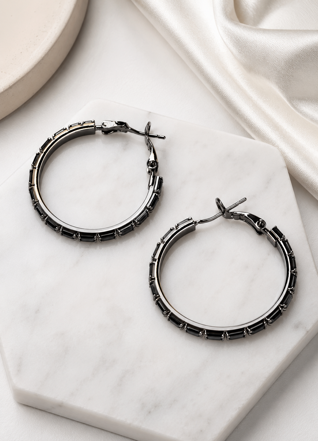 Model wearing elegant Orelva black crystal hoop earrings for everyday fashion.