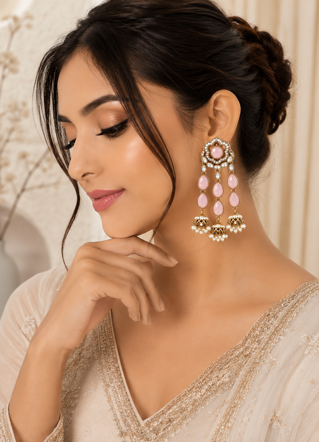 ORELVA Roselle blush pink Polki jhumka earrings worn by a model with an elegant ethnic outfit.