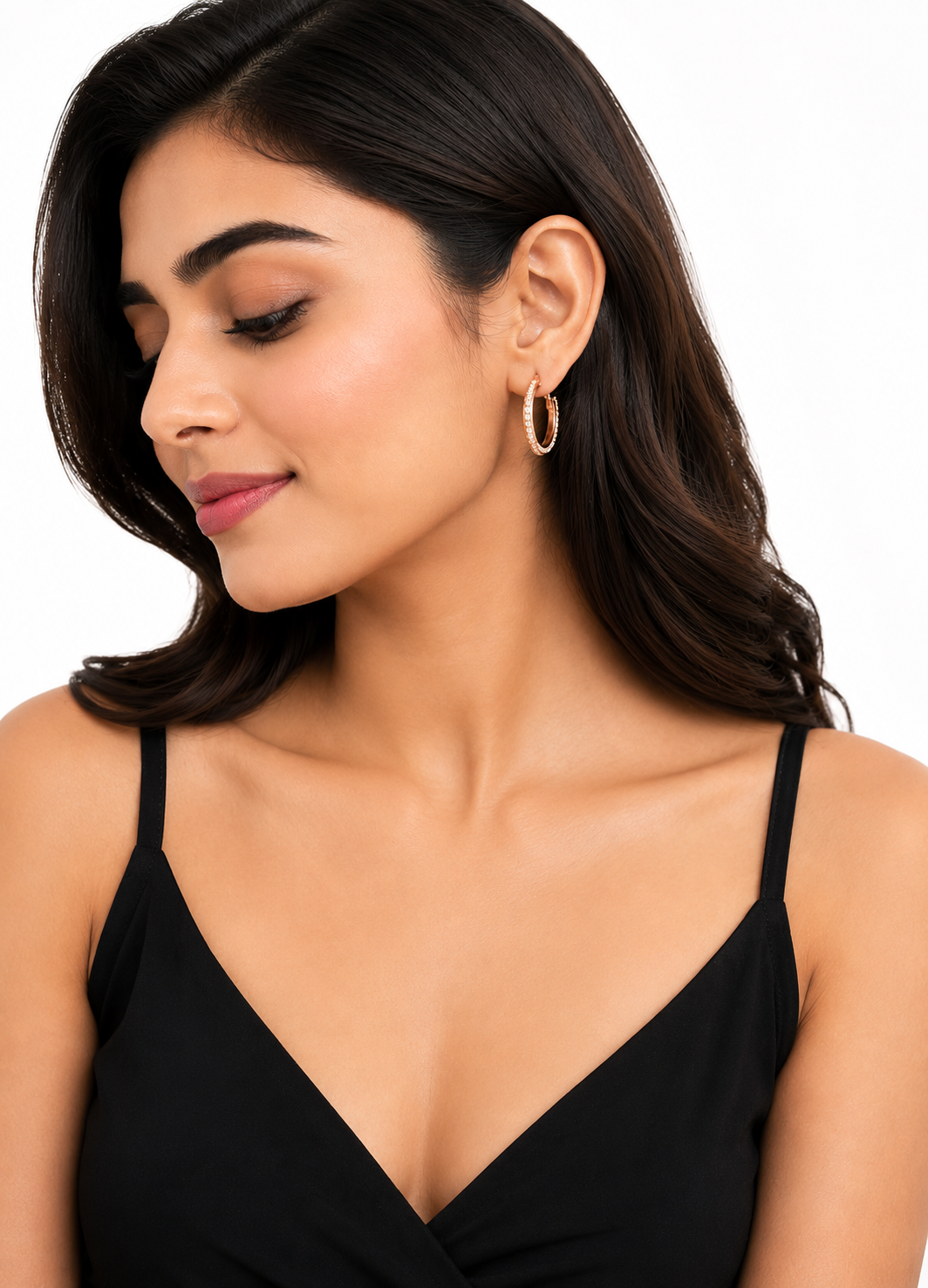 ORELVA Celeste rose gold crystal hoop earrings displayed on a premium stone background.