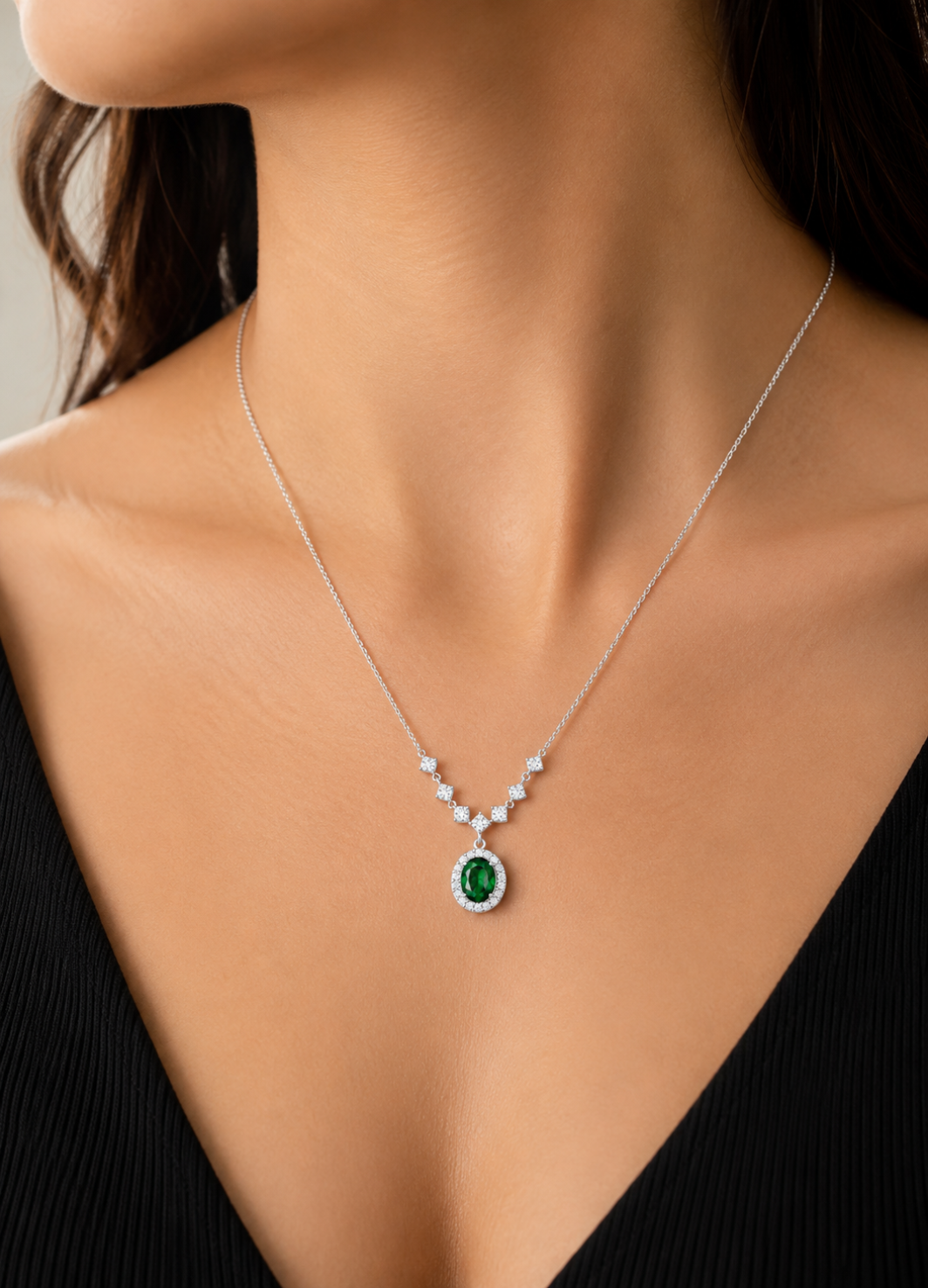 ORELVA 925 Sterling Silver Emerald Halo Necklace with oval green crystal and sparkling cubic zirconia accents.
