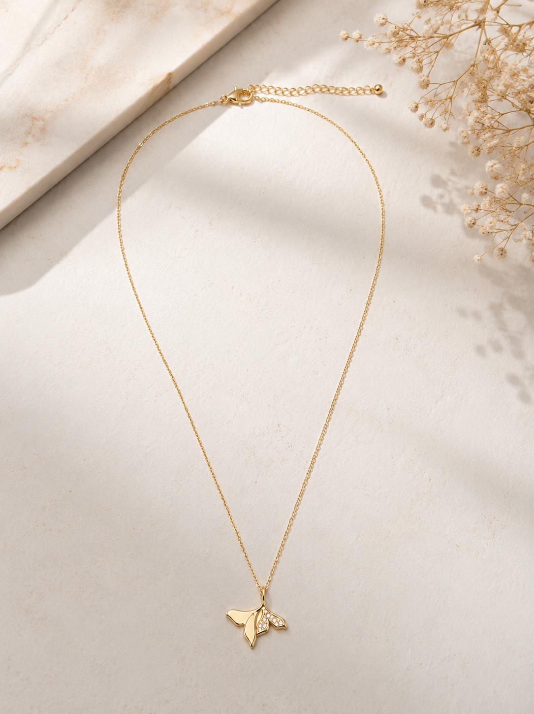 Elegant Orelva gold butterfly pendant necklace featuring crystal accents, perfect for everyday wear and special occasions.
