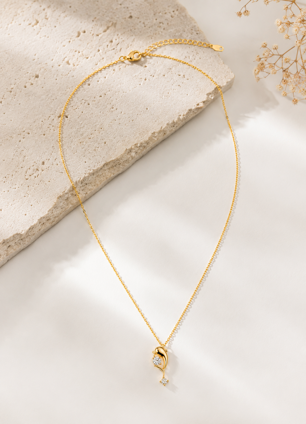 Orelva gold-tone crystal drop pendant necklace isolated on a white background showing the complete chain and pendant design.