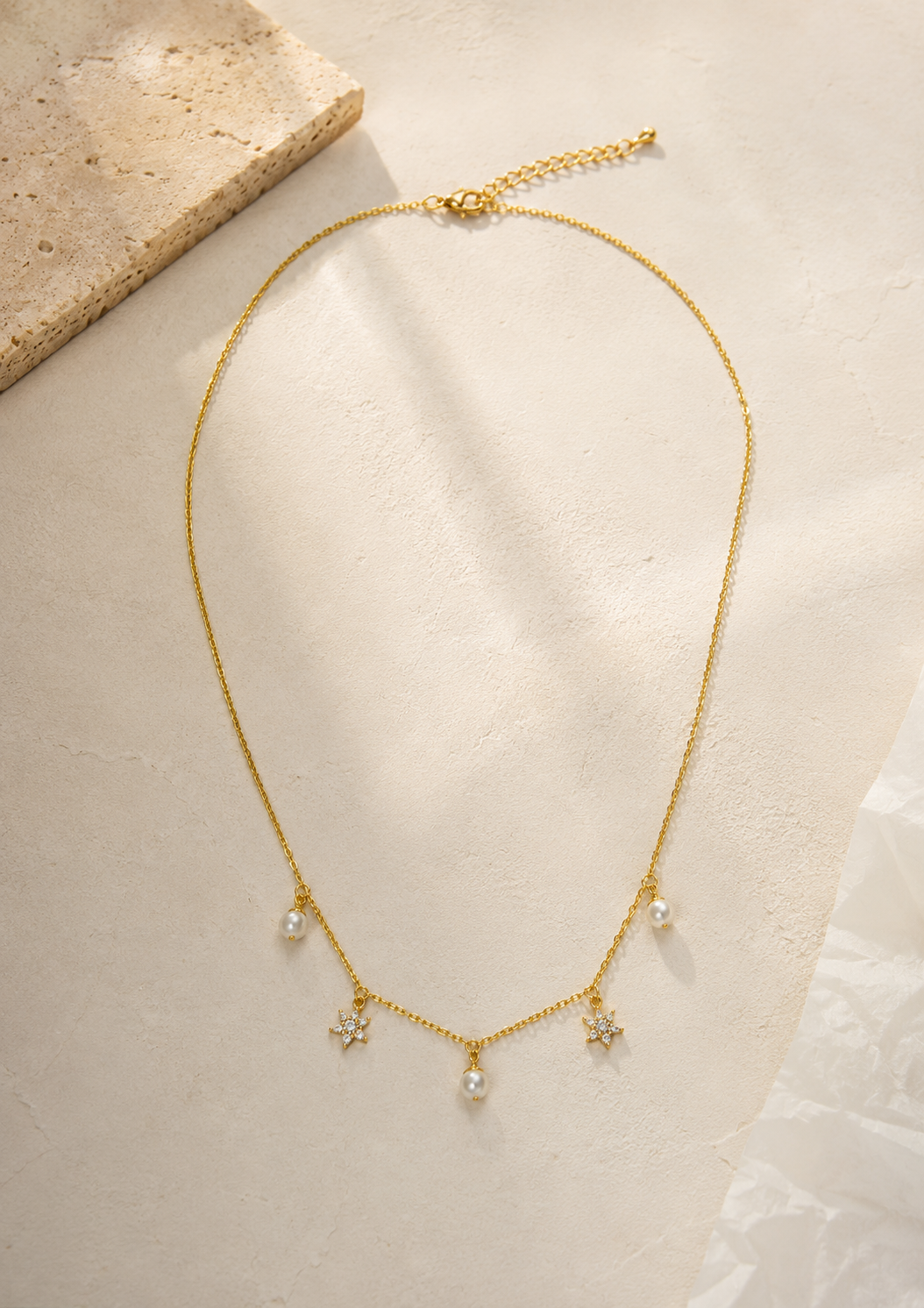 Elegant Gold Necklace with Pearl Drops and Crystal Star Charms