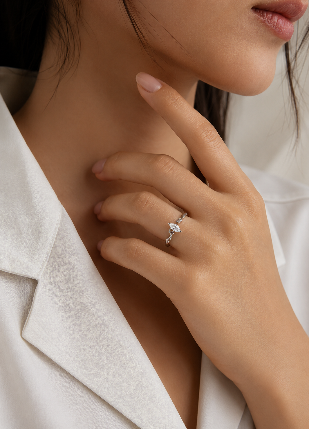 Woman wearing Orelva marquise crystal adjustable silver ring on finger