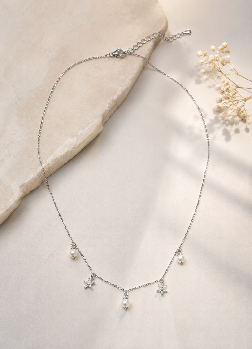 Elegant Silver Necklace with Pearl Drops and Crystal Star Charms