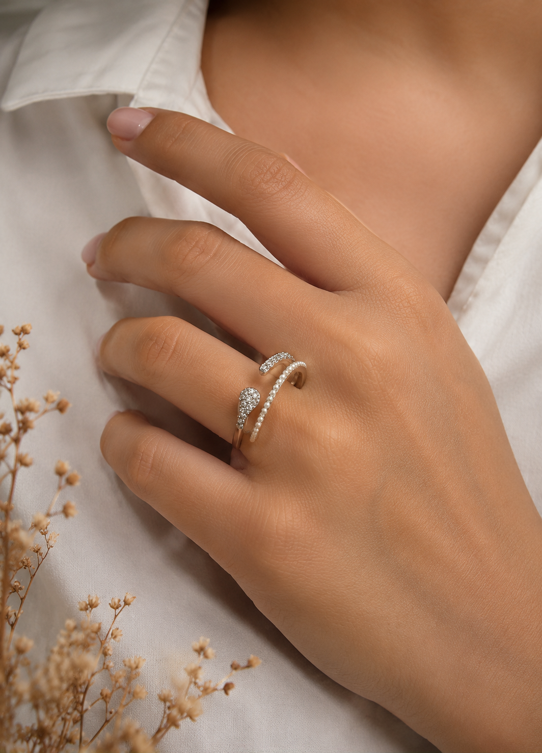 Orelva pearl and crystal adjustable silver ring worn on woman's finger