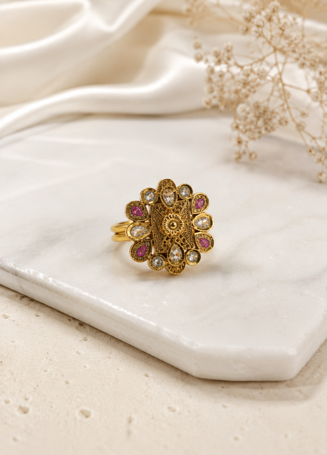 ORELVA Rajeshwari heritage adjustable ring displayed on a premium marble surface with elegant floral styling.