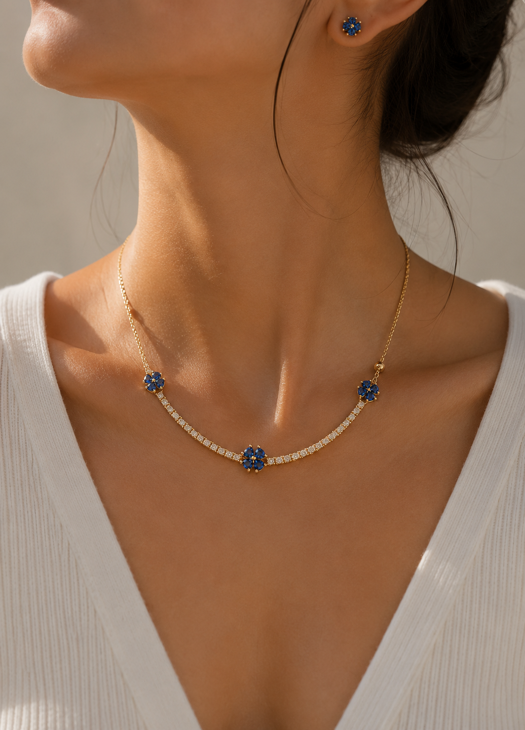 ORELVA Gold-Plated Sapphire Clover Necklace Set with Matching Blue Stud Earrings on Model