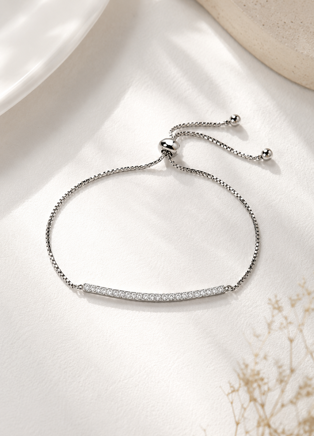 Silver adjustable bracelet featuring crystal bar centerpiece by Orelva