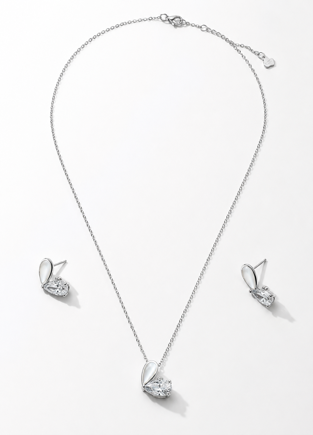 Elegant sterling silver jewelry set with pear cut CZ pendant and matching stud earrings