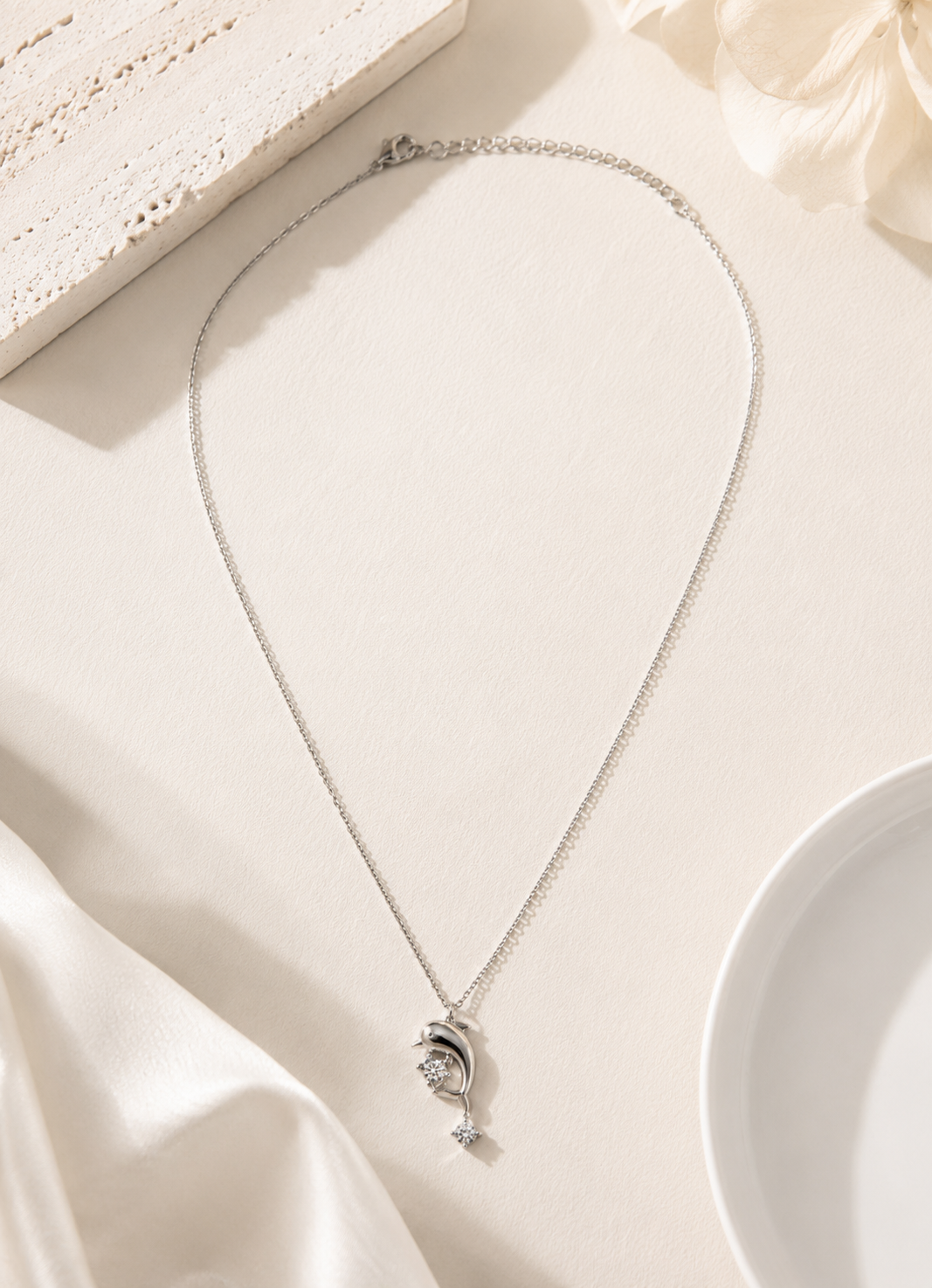 Elegant silver tone dolphin pendant necklace for women with crystal details